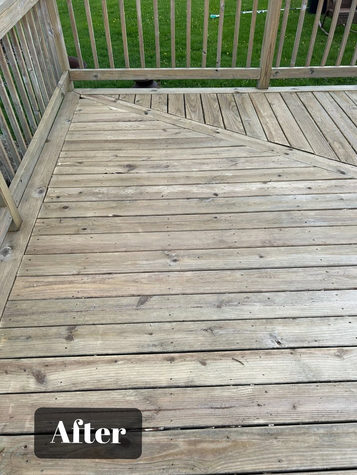 Cleaned and restored wooden deck with a fresh look, showcasing improved appearance.
