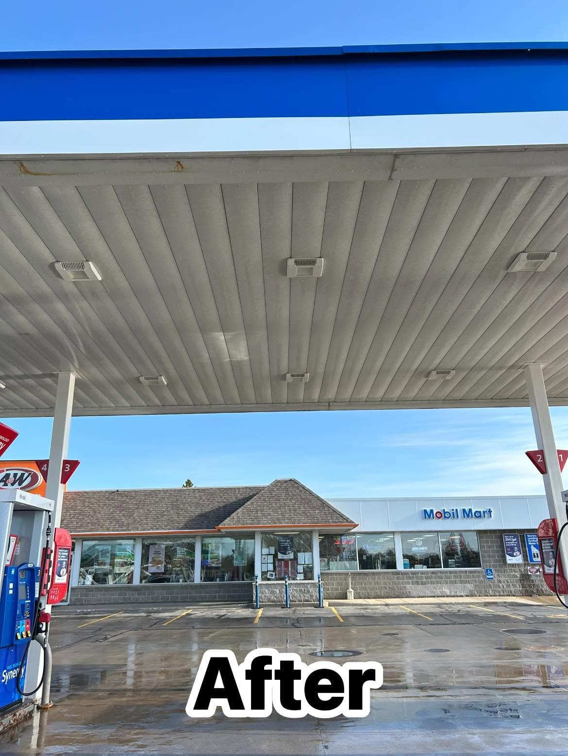 Clean gas station exterior with blue canopy and Mobil Mart signage on a sunny day.