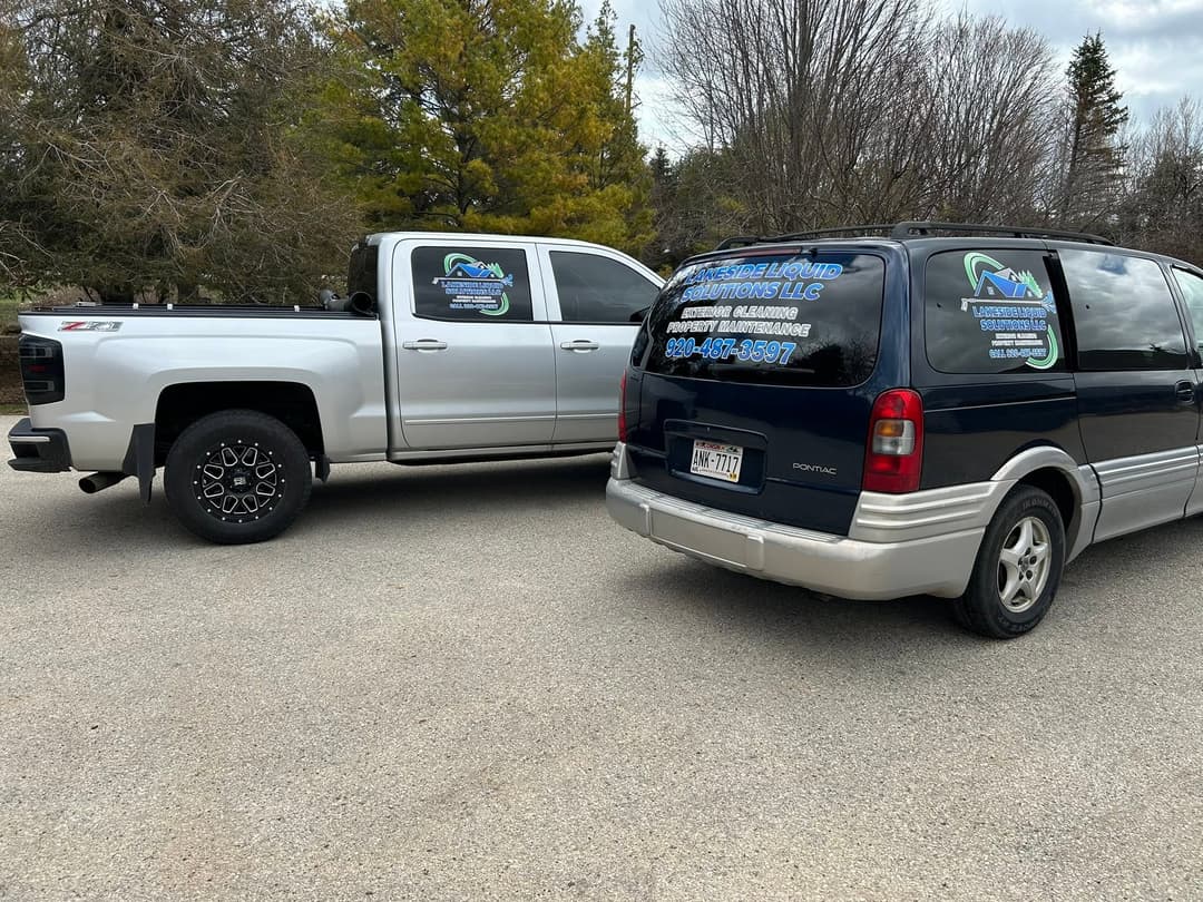 Company vehicles showcasing branding for Mountain View Construction LLC parked outdoors.